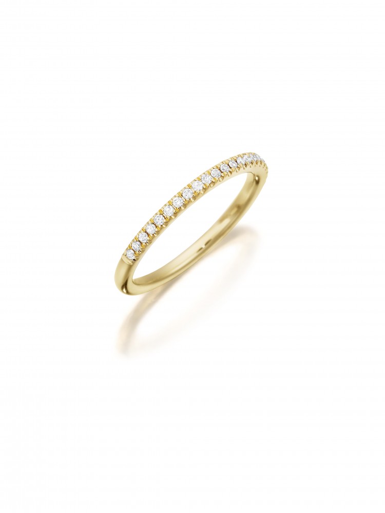 Henri Daussi yellow gold band featuring a single line of round brilliant white diamonds